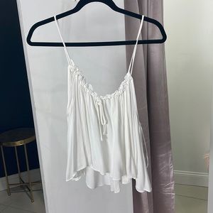 White sleeveless sheer top- ruffle accents